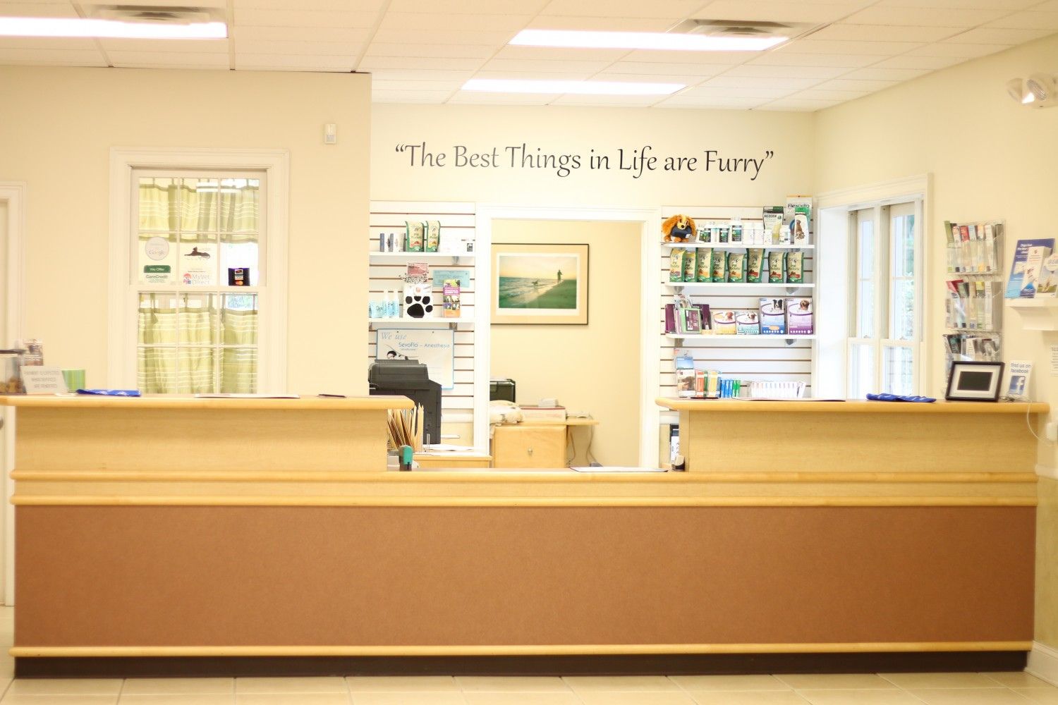the front desk of a doctor's office with a sign that says the best things in life are free